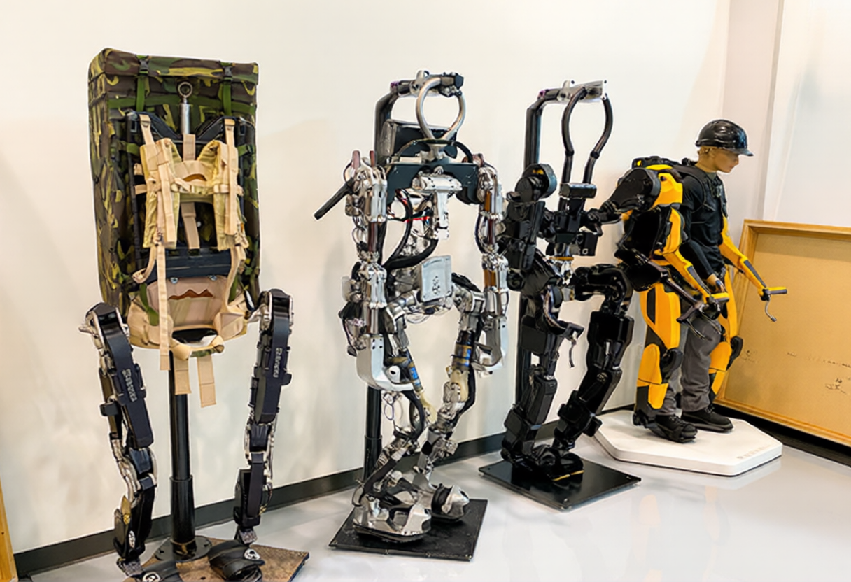 A lineup of four generations of Sarcos robotic exoskeletons