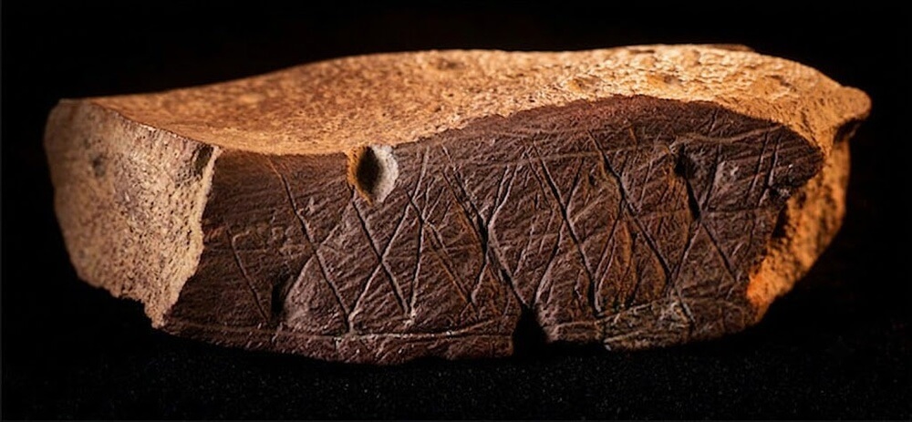 Engraved ochre piece discovered in Blombos Cave, South Africa.